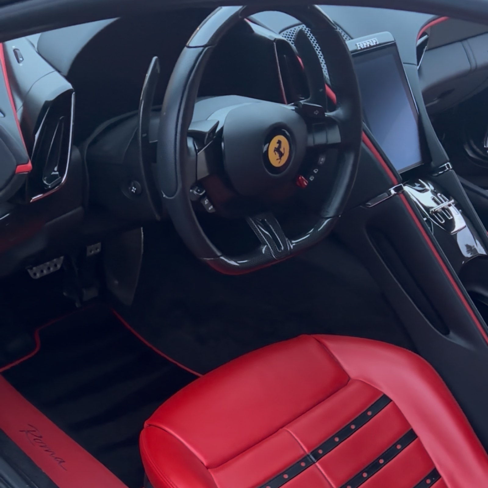 A spotless red and black sports car interior